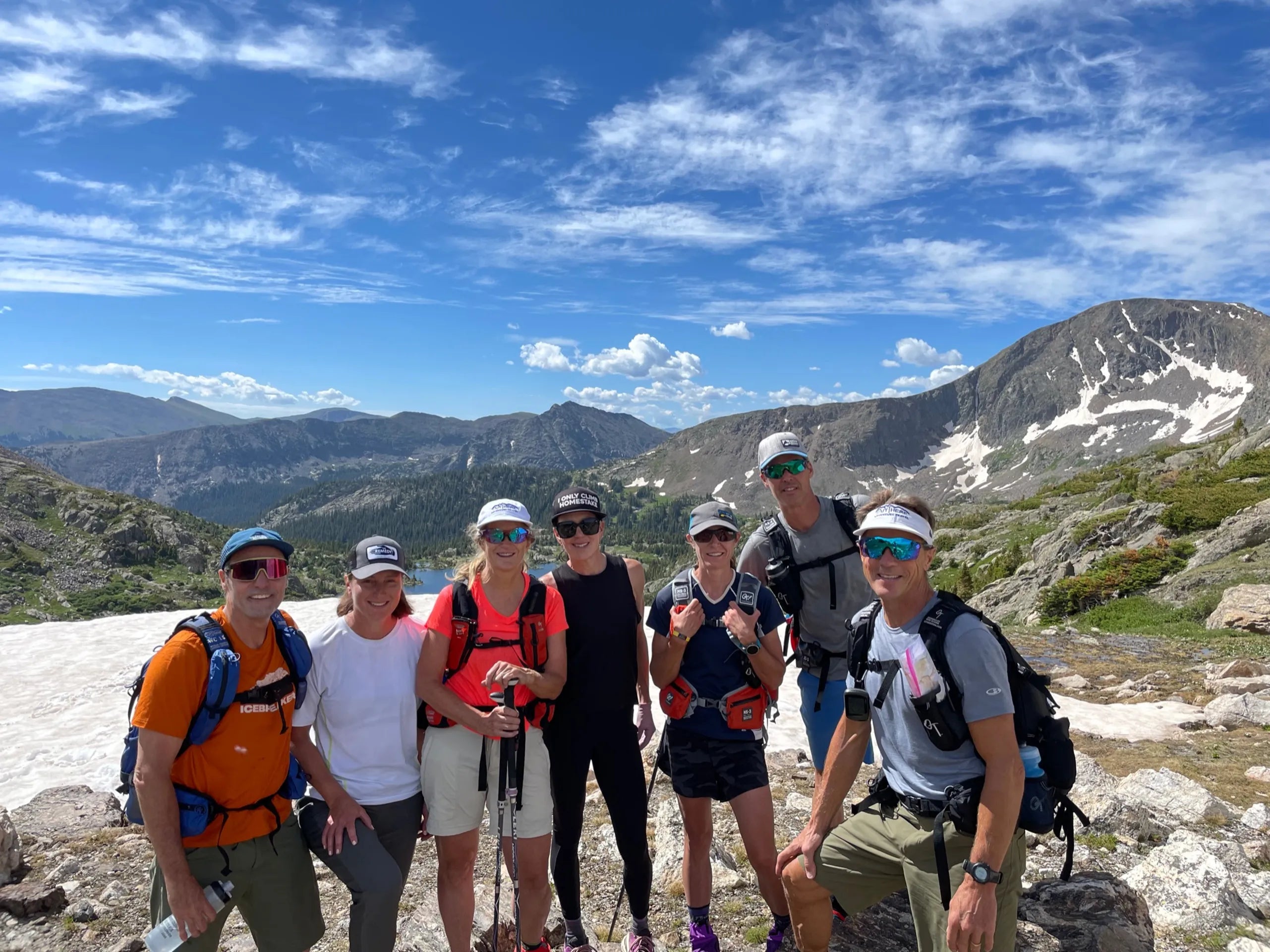 Hikers in the mountains wearing OutThere packs