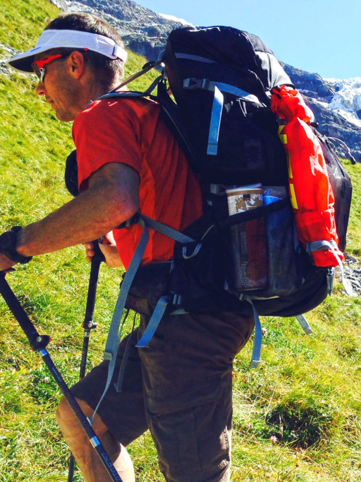 Profile of a hiker wearing an OutThere backpack, showing the ergonomic shoulder straps